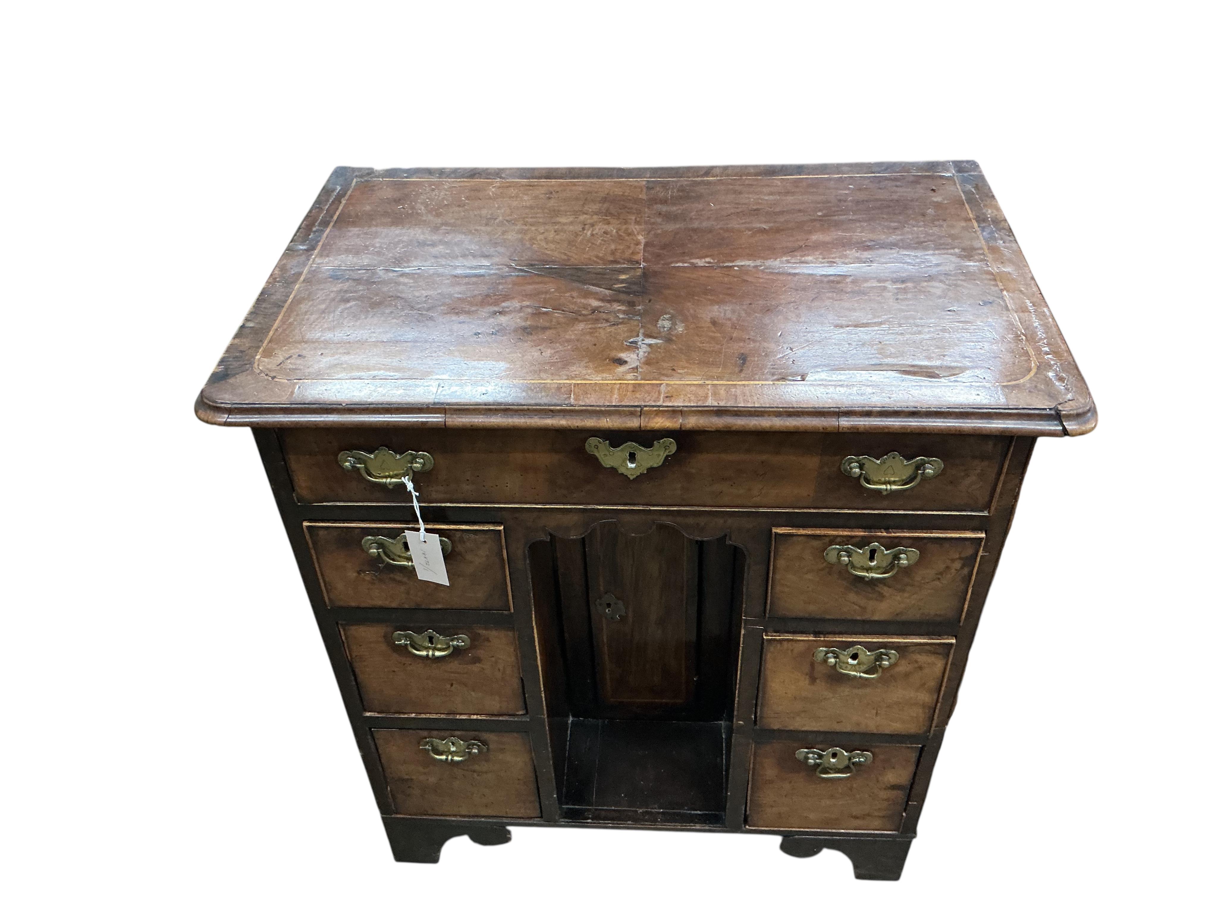 An 18th century walnut kneehole desk, width 79cm, depth 49cm, height 84cm